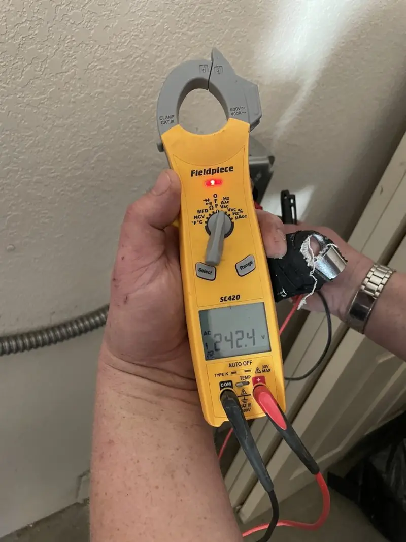 Voltage testing with clamp meter during Generator Installation in East Vincent